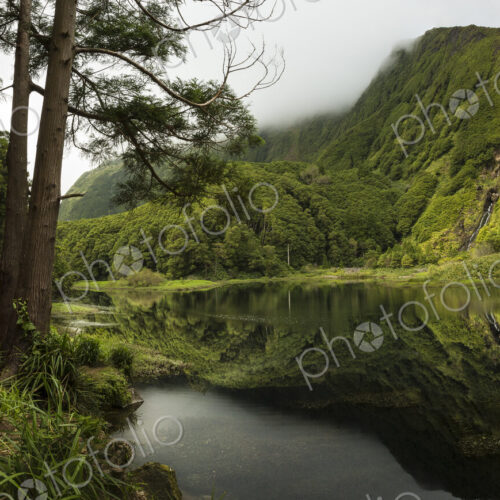 Still lake under remote mountains