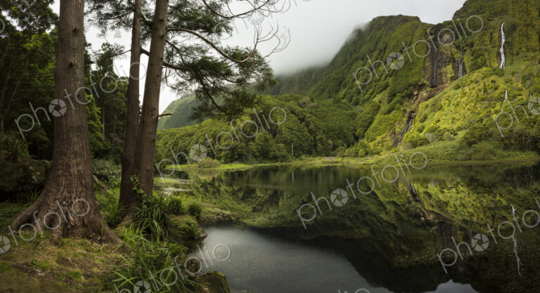 Still lake under remote mountains