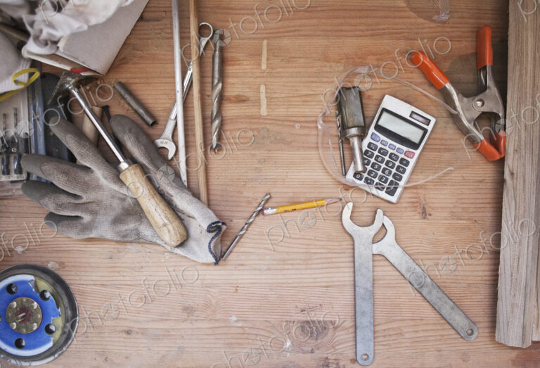 Still life of a desktop and tools in a woodworking factory.