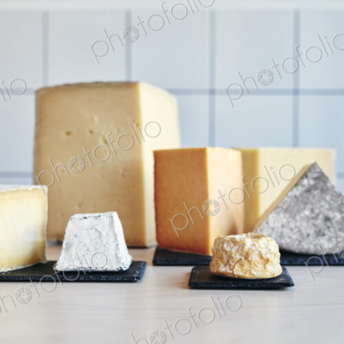 Still life of a range of cheeses on table top