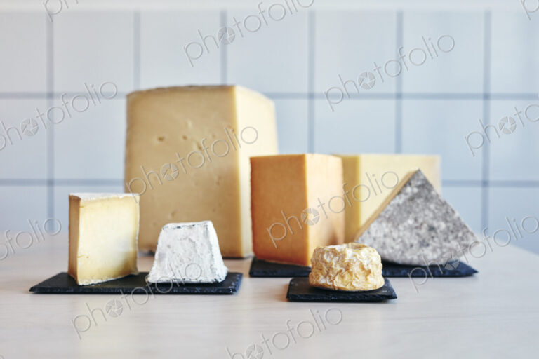 Still life of a range of cheeses on table top