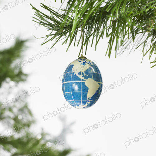 Still life. Green leaf foliage and decorations. A pine tree branch and a blue and… Still life. Green leaf foliage and decorations. A pine tree branch and a blue and…