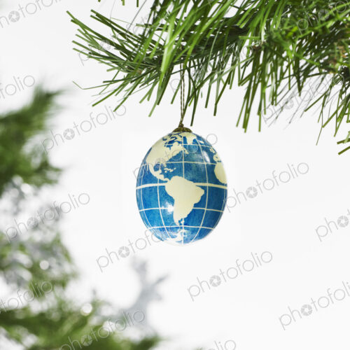 Still life. Green leaf foliage and decorations. A pine tree branch and a blue and… Still life. Green leaf foliage and decorations. A pine tree branch and a blue and…