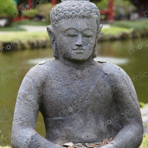 Stone Buddha with Offerings Stone Buddha with Offerings