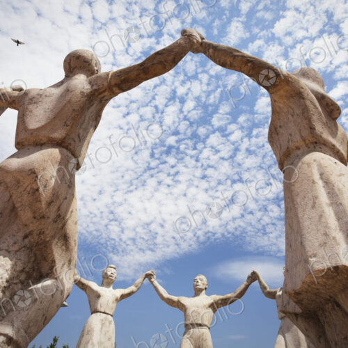 Stone sculptures of the La Sardana Monument in Barcelona.