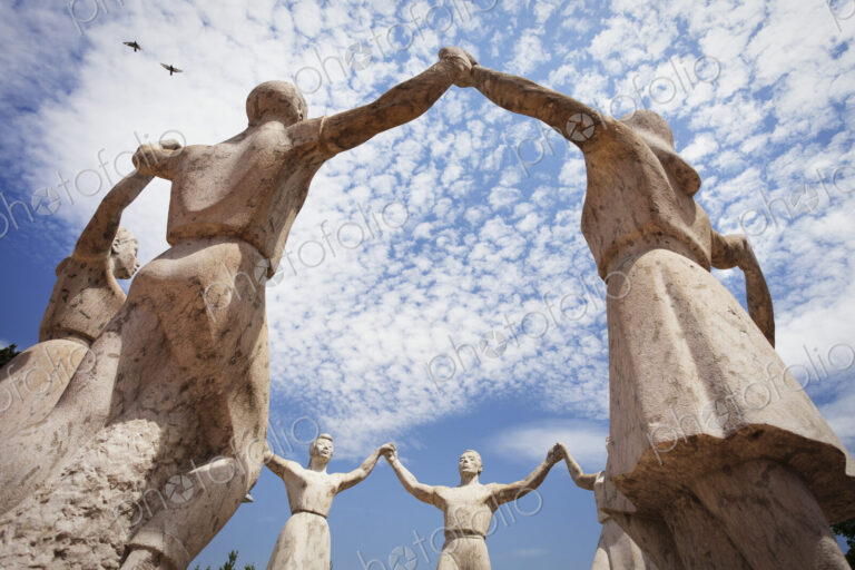 Stone sculptures of the La Sardana Monument in Barcelona.