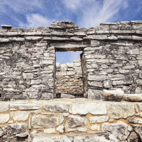 Stone steps and doorway in the archaeological site and Mayan ruins of Tulum Stone steps and doorway in the archaeological site and Mayan ruins of Tulum