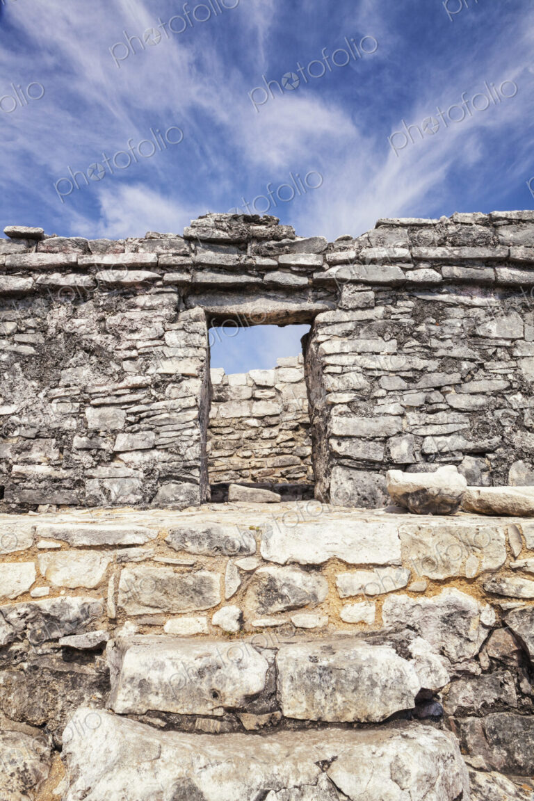 Stone steps and doorway in the archaeological site and Mayan ruins of Tulum