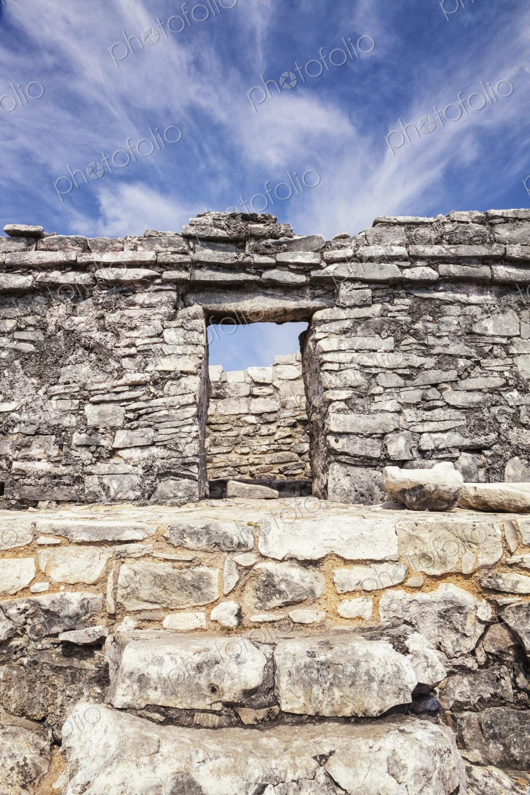 Stone steps and doorway in the archaeological site and Mayan ruins of Tulum