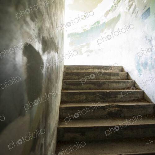 Stone steps leading up from a bunker in the fortifications at Fort Worden State Park. Stone steps leading up from a bunker in the fortifications at Fort Worden State Park.