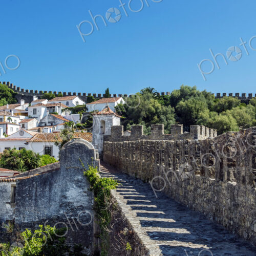 Stone walkway and Obidos cityscape, Leiria, Portugal Stone walkway and Obidos cityscape, Leiria, Portugal