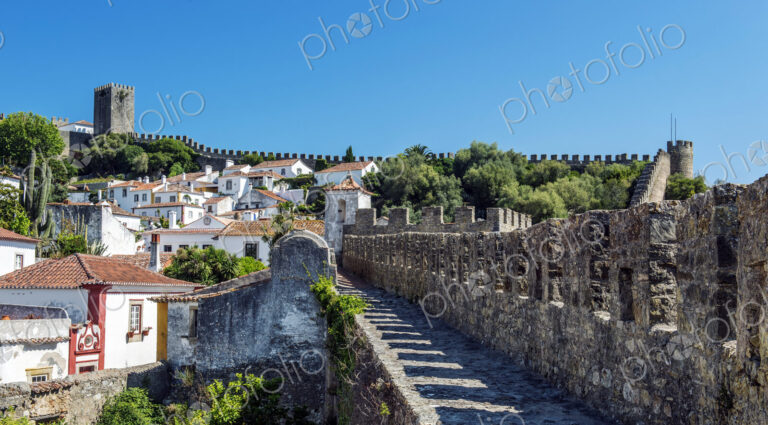 Stone walkway and Obidos cityscape, Leiria, Portugal