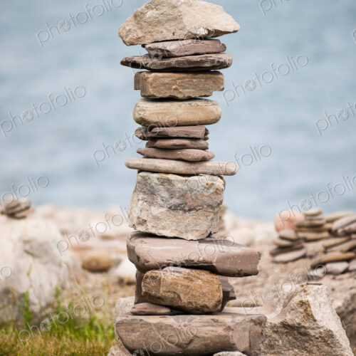 Stones piled up with ocean beyond. Stones piled up with ocean beyond.
