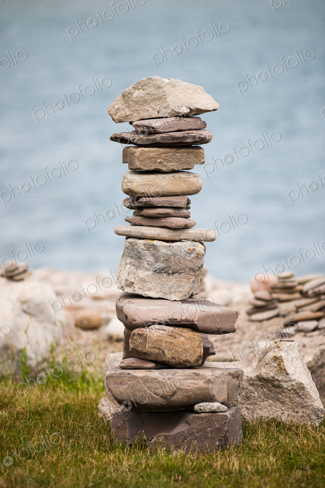 Stones piled up with ocean beyond.