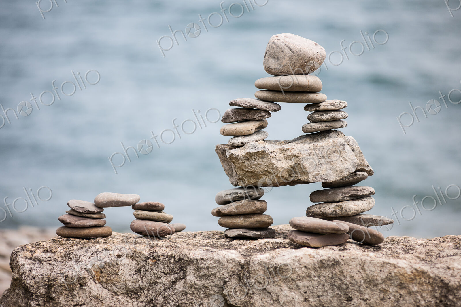 Stones piled up with ocean beyond.