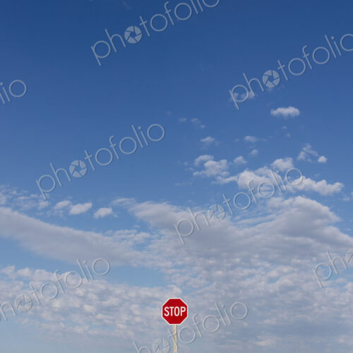 Stop sign and blue sky, near Cadillac, Saskatchewan, Canada.