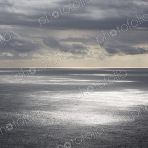 Storm clouds clearing over expansive ocean, dappled sunlight on water, northern Oregon… Storm clouds clearing over expansive ocean, dappled sunlight on water, northern Oregon…