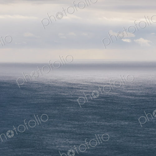 Storm clouds clearing over expansive ocean, dappled sunlight on water, northern Oregon… Storm clouds clearing over expansive ocean, dappled sunlight on water, northern Oregon…