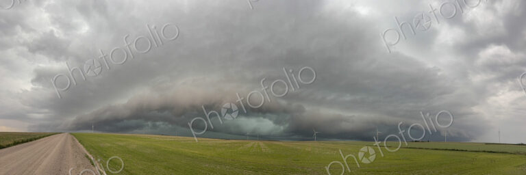 Storm with a Mesocyclone or a Rotating Updraft, a cloud formation rising above a green…