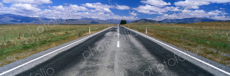 Straight Highway and Fair Weather Cumulus Clouds