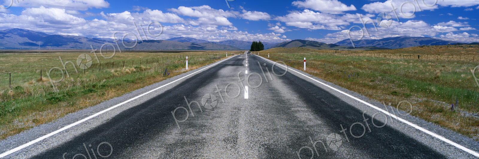 Straight Highway and Fair Weather Cumulus Clouds