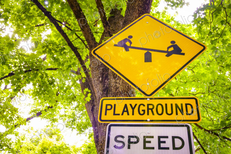 Street sign for a children's playground and speed limit, Spokane, Washington.