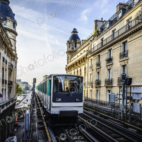 Streetcar passing between apartment buildings, Paris, France Streetcar passing between apartment buildings, Paris, France