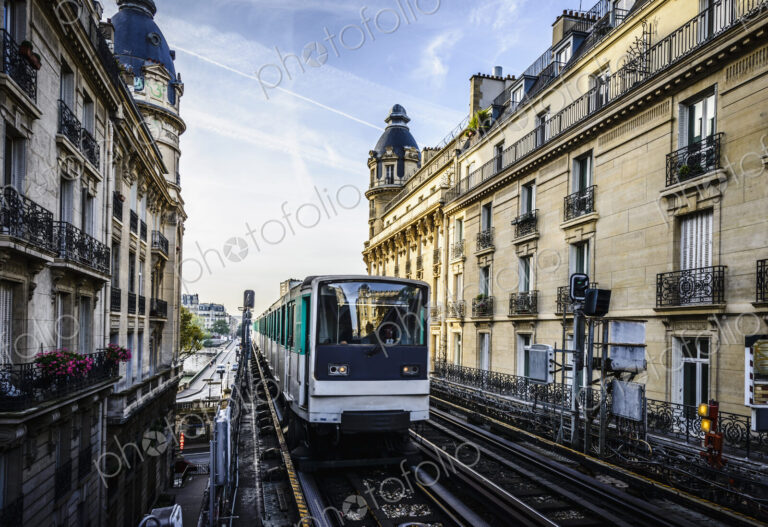 Streetcar passing between apartment buildings, Paris, France