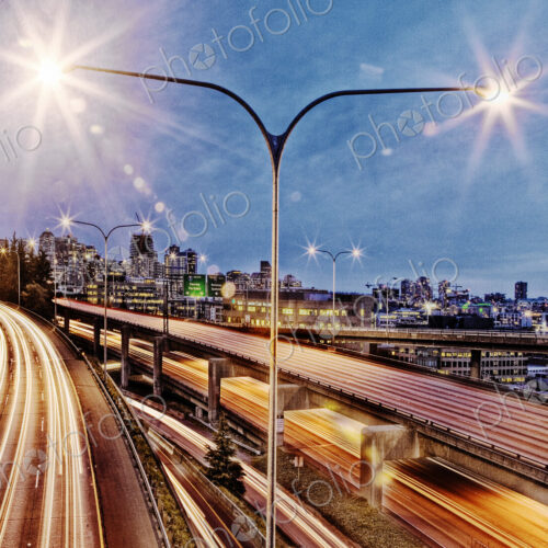 Streetlamp over freeway at night, Seattle, Washington, United States Streetlamp over freeway at night, Seattle, Washington, United States