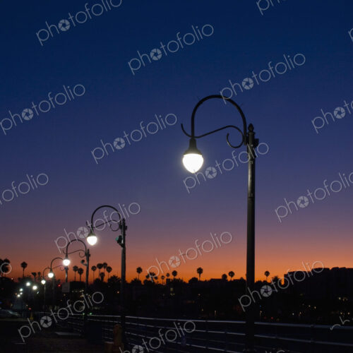 Streetlight with palm trees at sunset. Streetlight with palm trees at sunset.