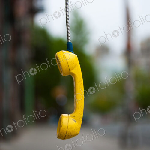 Streets of New York City. USA. An abandoned telephone receiver.