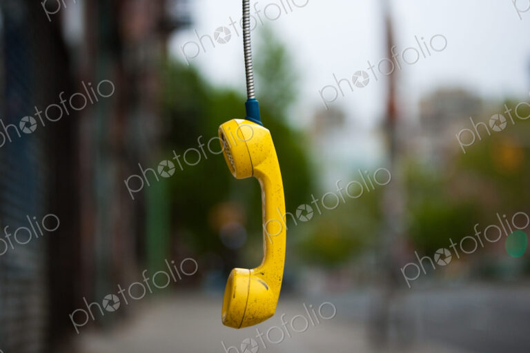 Streets of New York City. USA. An abandoned telephone receiver.