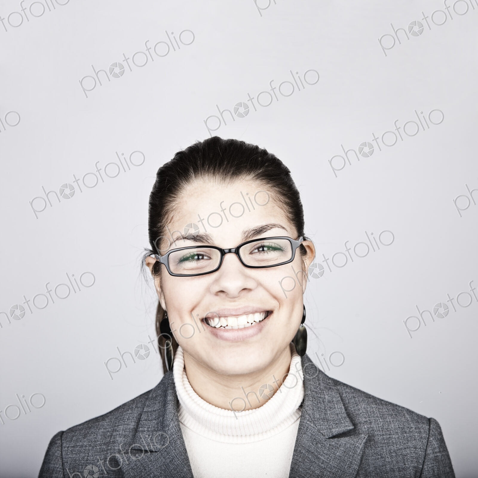 Studio portrait of a young Hispanic woman