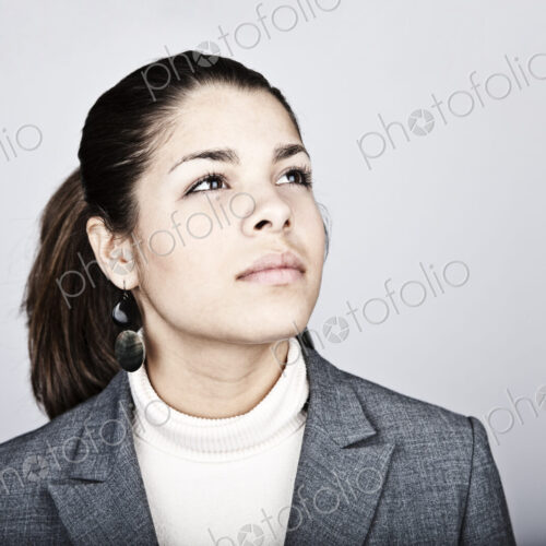 Studio portrait of a young Hispanic woman