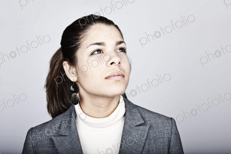 Studio portrait of a young Hispanic woman