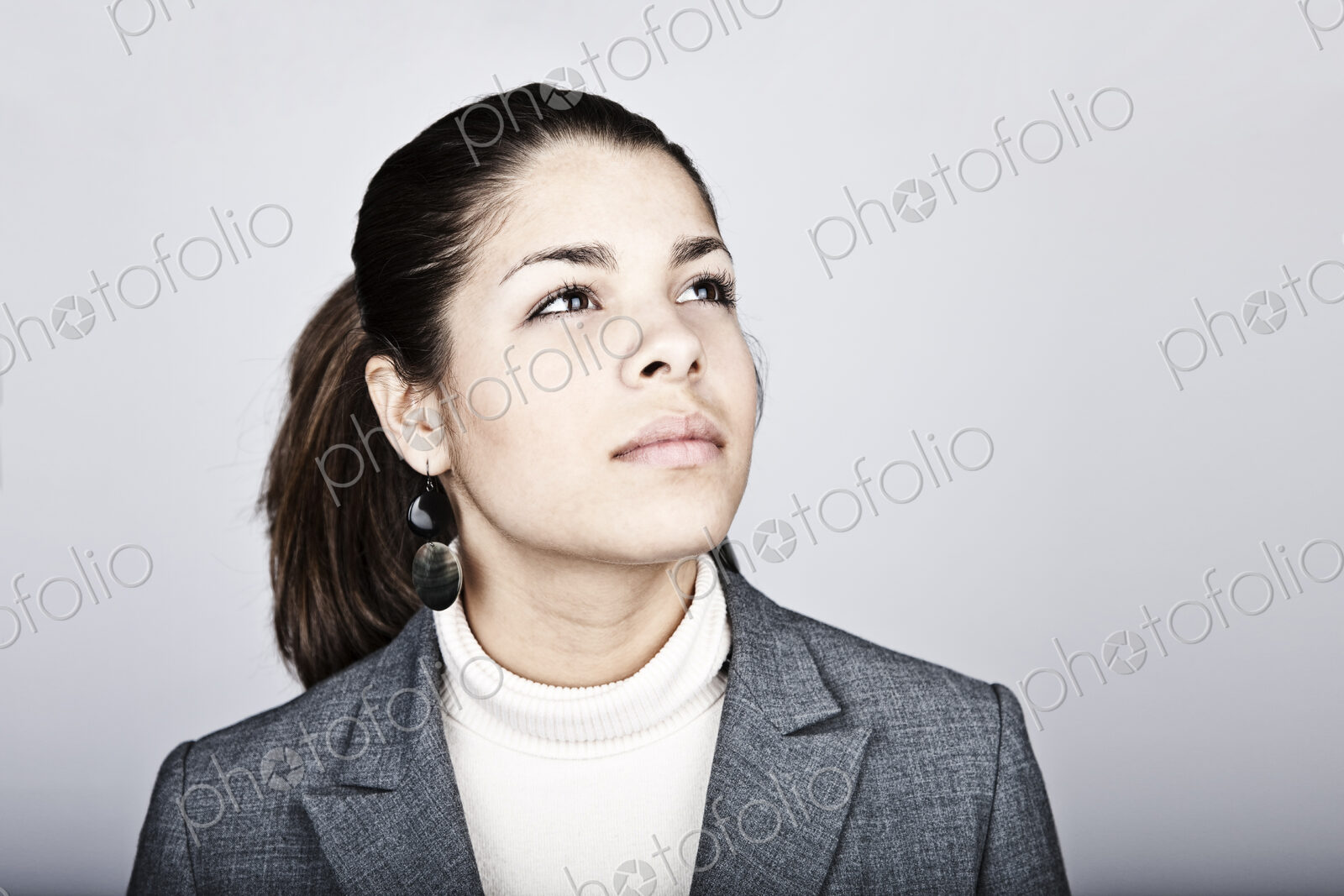 Studio portrait of a young Hispanic woman