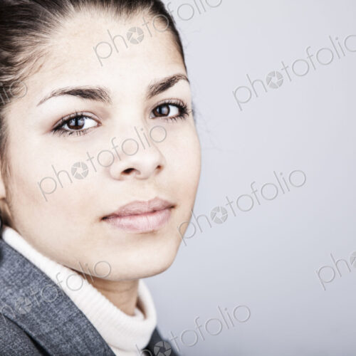 Studio portrait of a young Hispanic woman
