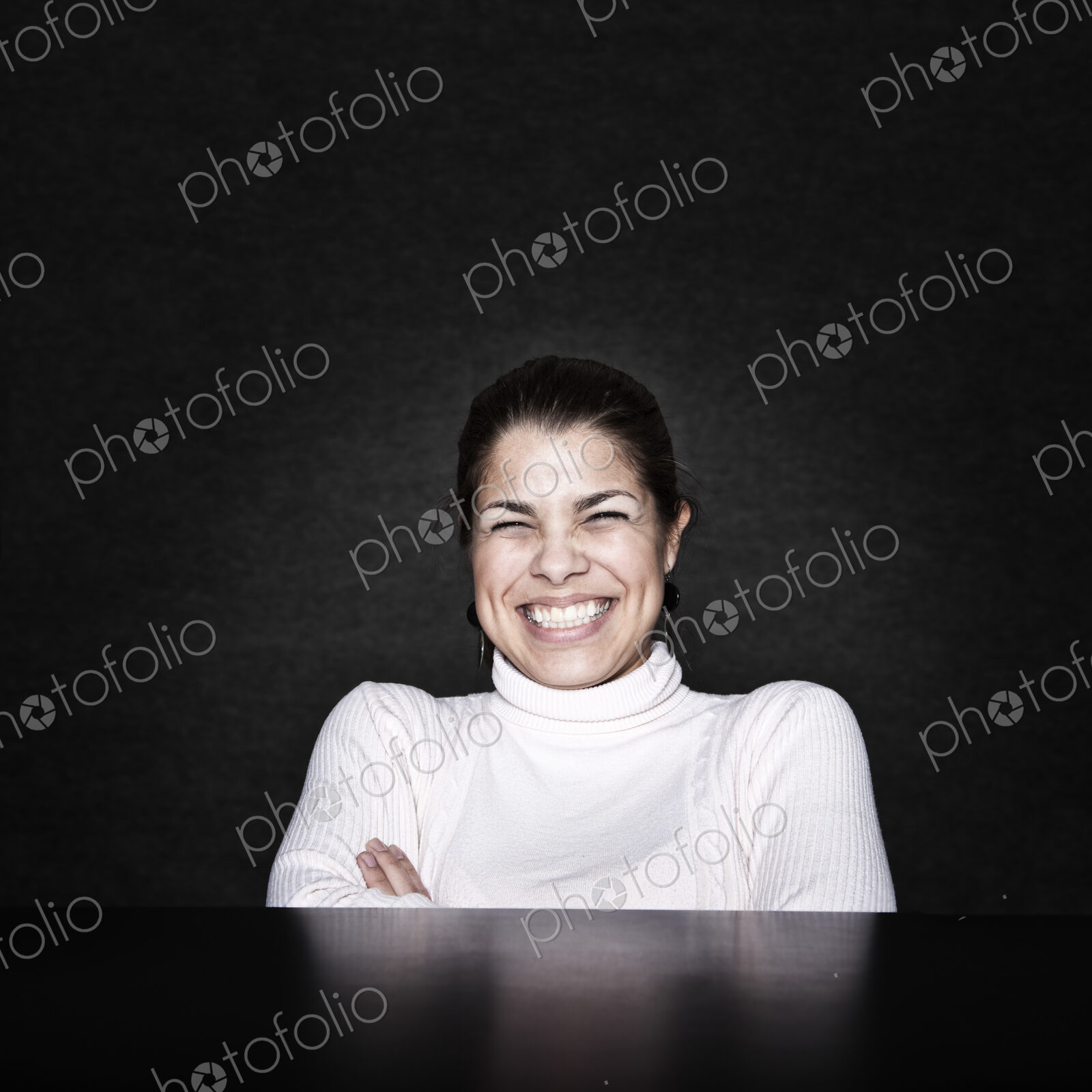 Studio portrait of a young Hispanic woman