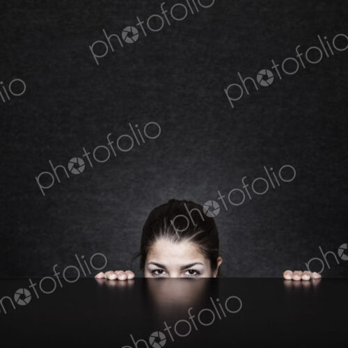Studio portrait of a young Hispanic woman