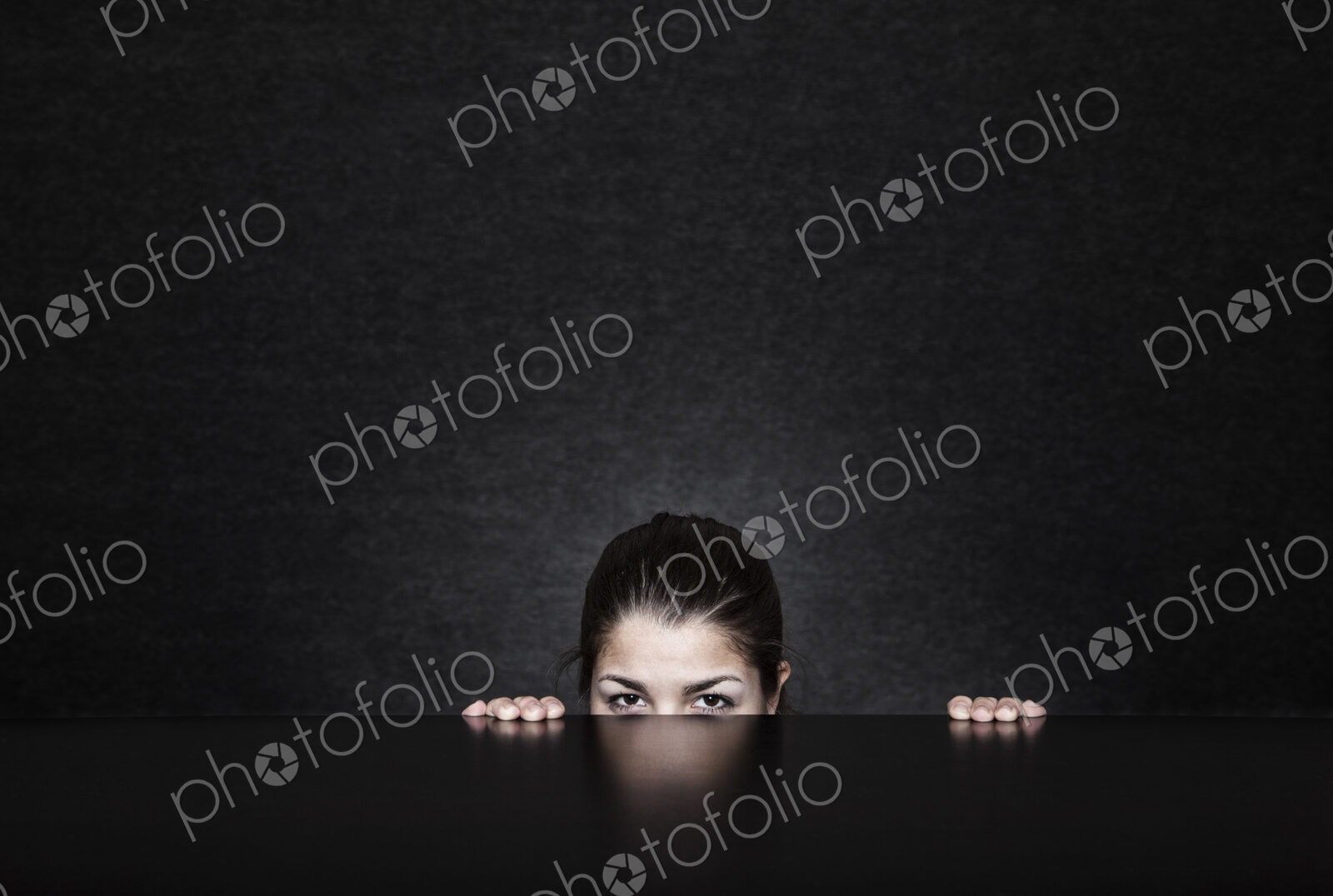 Studio portrait of a young Hispanic woman