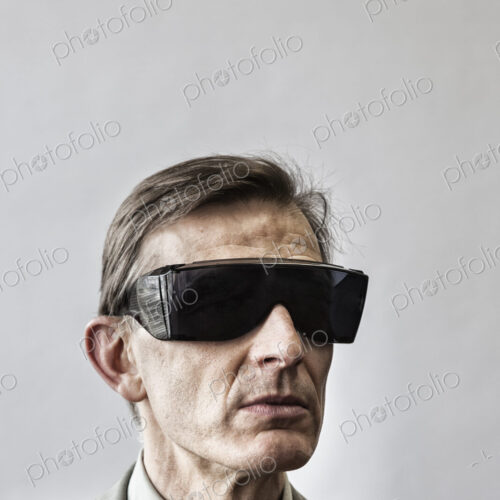 Studio portrait of caucasian man actor wearing large sunglasses or protective… Studio portrait of caucasian man actor wearing large sunglasses or protective…