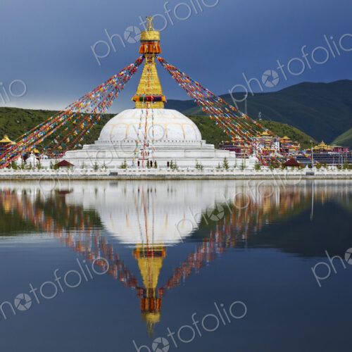 Stupa at the Zhuqing Wujian Zen Forest Monastery, decorated with prayer flags,… Stupa at the Zhuqing Wujian Zen Forest Monastery, decorated with prayer flags,…