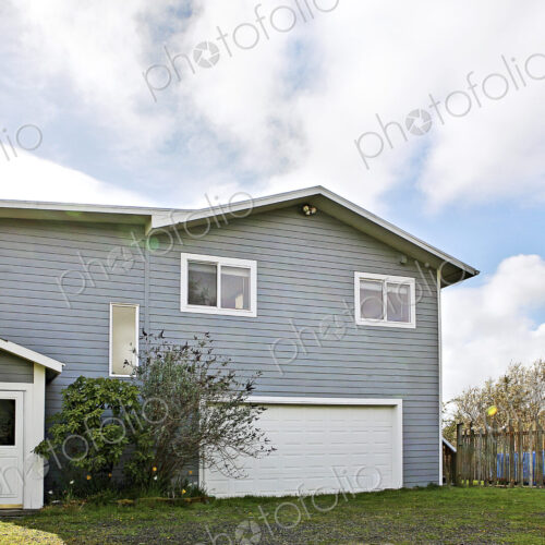 Suburban house under cloudy sky Suburban house under cloudy sky