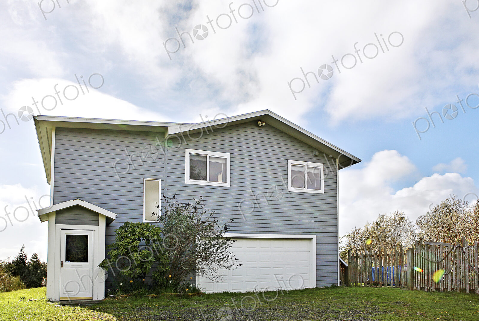 Suburban house under cloudy sky