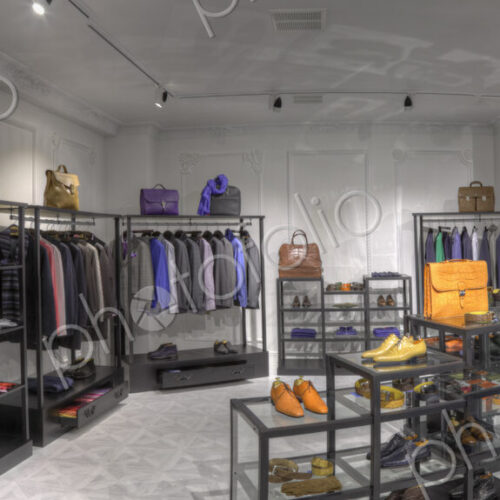 Suits and shoes in clothing store for men Suits and shoes in clothing store for men
