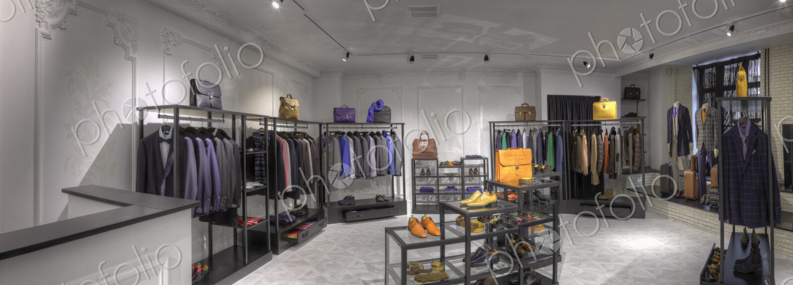 Suits and shoes in clothing store for men