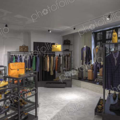 Suits and shoes in clothing store for men Suits and shoes in clothing store for men