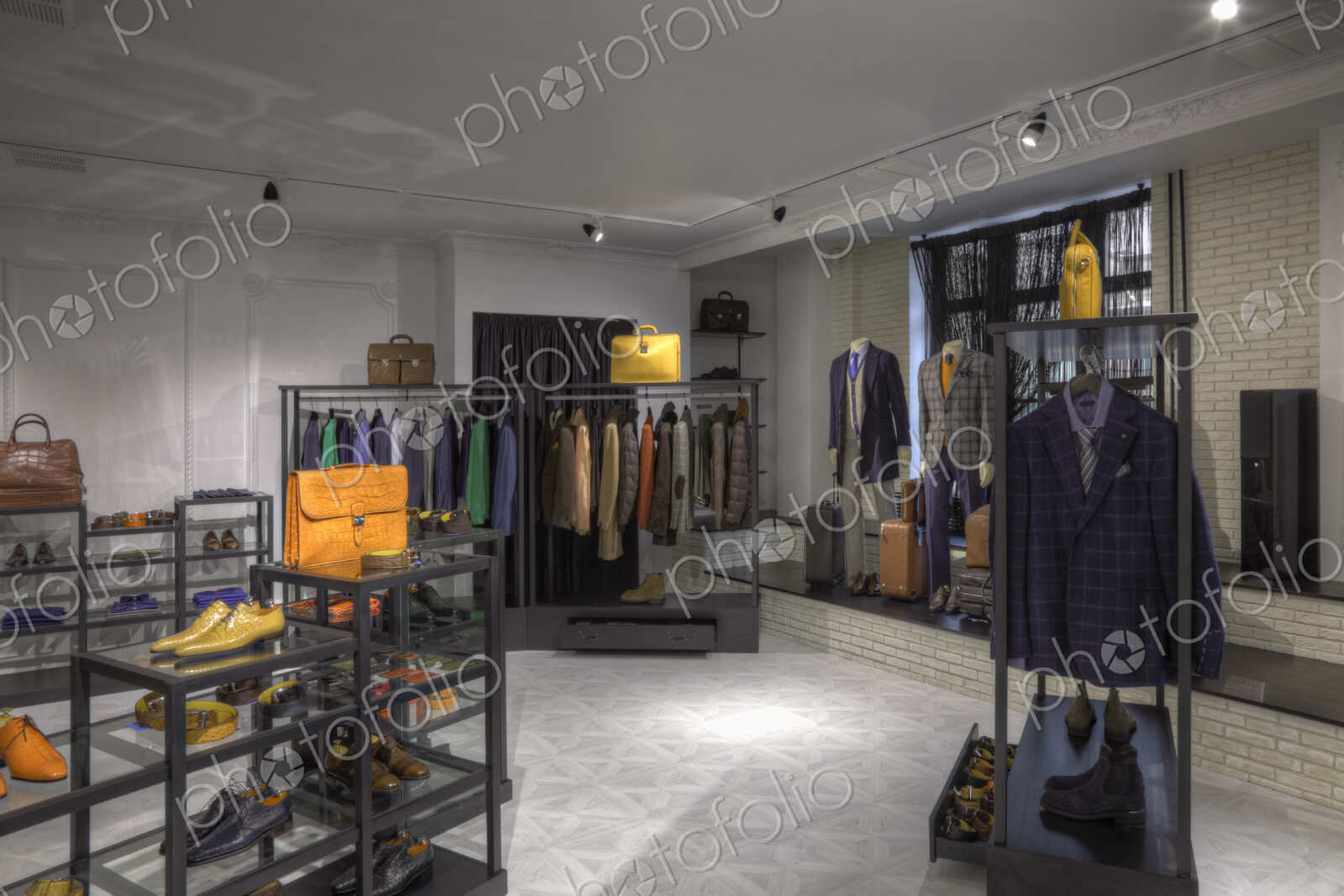Suits and shoes in clothing store for men