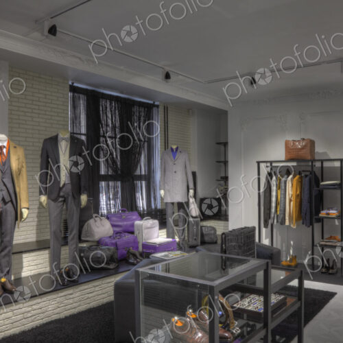 Suits and shoes in clothing store for men Suits and shoes in clothing store for men