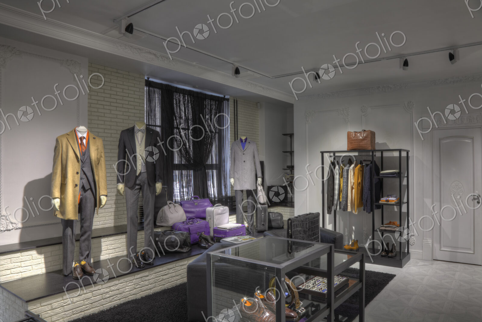 Suits and shoes in clothing store for men